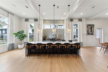 A large conference room with a long table and chairs.